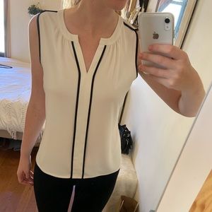 White Calvin Klein blouse with black trim